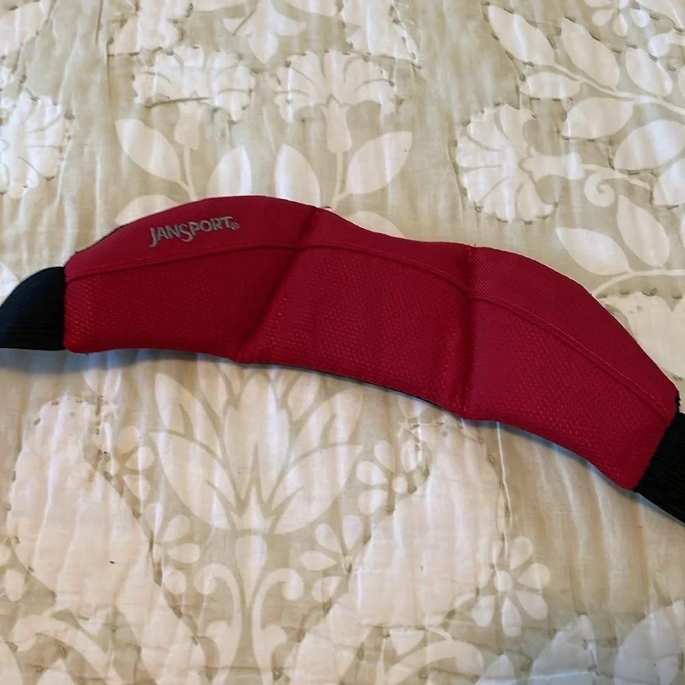 Red Jansport laptop messenger bag. Interior Velcro & outer zippered compartment